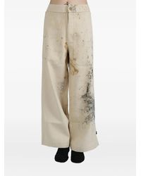 Commun's - Paint-splattered wide-leg trousers - Lyst