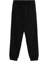 Champion - Pantalones de chándal con bajos elásticos - Lyst