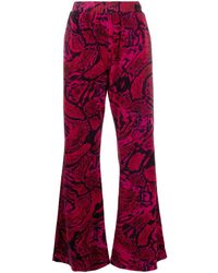 Aries - Snakeskin-print Flared Trousers - Lyst
