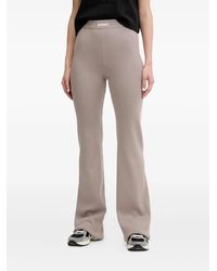 Guess - Logo-Detail Ribbed Trousers - Lyst