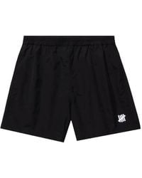 Undefeated - Logo-Plaque Swim Shorts - Lyst