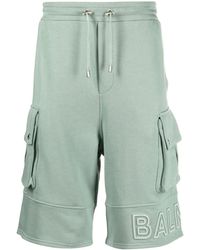 Balmain - Embossed-Logo Cotton Bermuda Shorts - Lyst