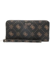 Guess - Cartera Carrie Monogram con cremallera - Lyst