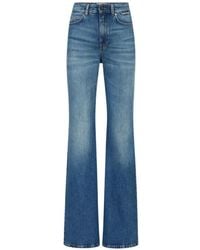 Iceberg - Vaqueros acampanados con parche del logo - Lyst