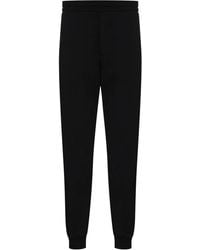 McQueen - Pantalones de chándal rectos con franja del logo - Lyst