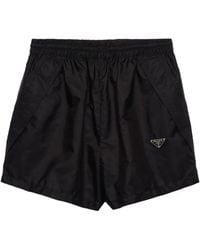 Prada - Pantalones cortos con logo triangular - Lyst