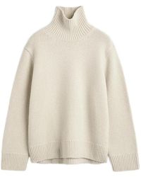 TOTEME - Oversized Lambswool Turtleneck Sweater Almond - Lyst
