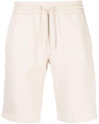 Calvin Klein - Pantalones cortos de deporte con franjas del logo - Lyst