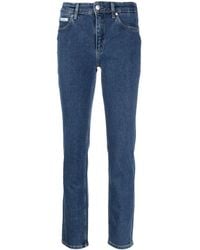 Calvin Klein - Jeans slim a vita media - Lyst