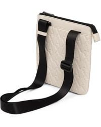 ARMANI EXCHANGE - Logo-Embossed Messenger Bag - Lyst