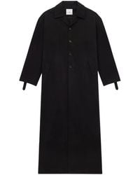 Courreges - Abrigo revestido con botones - Lyst