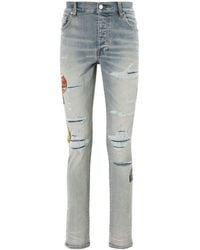 Amiri - Jeans Travel Patch Repair skinny con applicazione - Lyst