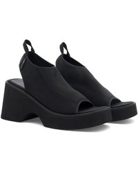サンダル・ミュール Courreges Black stretch polyester blend Scusa Wave slippers courrèges Black stretch polyester blend Scusa Wave slippers