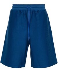 Moncler - Shorts sportivi con logo goffrato - Lyst