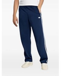 adidas - Firebird Gestreepte Broek Met Logo - Lyst