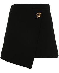Moschino - Shorts con logo inciso - Lyst