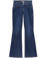 FRAME - Vaqueros acampanados de talle alto - Lyst
