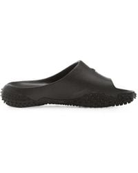 PUMA - Mostro Pantoletten Mit Logo - Lyst