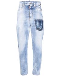 DSquared² - Logo-patch Distressed-effect Tapered Jeans - Lyst