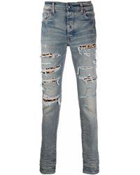 Amiri - Ripped-detail Jeans - Lyst