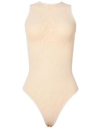 Wolford - Infinite Rose Net Bodysuit - Lyst