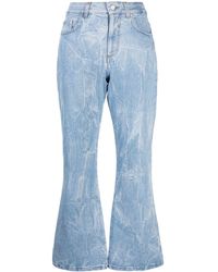Stella McCartney - Jeans con applicazione logo - Lyst