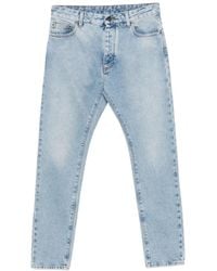 Palm Angels - Vaqueros con logo estampado - Lyst