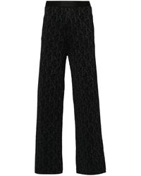パンツ PALM ANGELS MONOGRAM JACQUARD KNIT TROUSERS Palm Angels Monogram-Jacquard Knitted Trousers in Black | Lyst