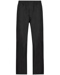 Prada - Logo-Plaque Trousers - Lyst