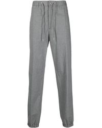 Moncler - Pantalones de chándal con logo en relieve - Lyst