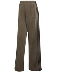 adidas - Firebird Ruimvallende Trainingsbroek - Lyst