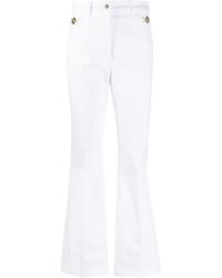 Patou - Logo-Embroidered Flared Jeans - Lyst