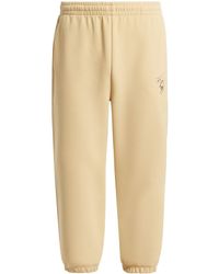 Lacoste - Pantalones de chándal con estampado gráfico - Lyst