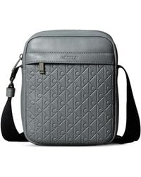 Calvin Klein - Logo-Embossed Messenger Bag - Lyst