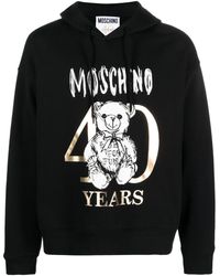 Moschino - Hoodie en coton à logo imprimé - Lyst