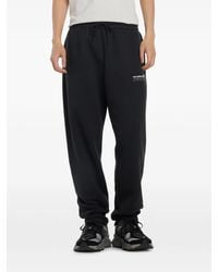 New Balance - Pantalones de chándal con logo - Lyst