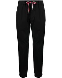 Moncler - Pantalones de chándal con parche del logo - Lyst