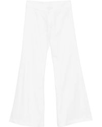 BLAKLACE - Flared Trousers - Lyst