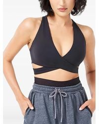 SQUATWOLF - Criss-Cross Sports Bra - Lyst