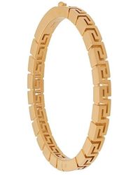 Versace - Bracelet torque à logo gravé - Lyst
