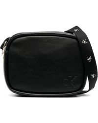 Calvin Klein - Logo-embossed Faux-leather Crossbody Bag - Lyst