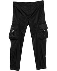 Prada - Hose mit Logo-Schild - Lyst