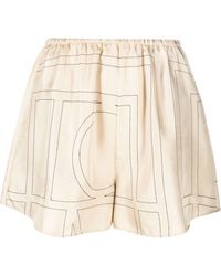 Totême - Pantalones cortos PJ con monograma - Lyst