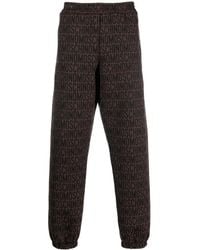 Moschino - All-Over Embroidered Logo Track Pants - Lyst