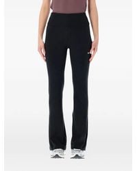 Nike - Logo-Detail Flared Leggings - Lyst