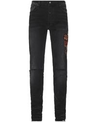 Amiri - Patch-Detail Distressed Jeans - Lyst