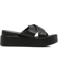SERGIO MORETTI FIRENZE - Studded Crossover-Strap Mules - Lyst