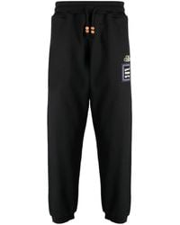 Adish - Alkhws Logo-Print Cotton Track Pants - Lyst