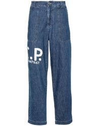 C.P. Company - Logo-print Tapered Jeans - Lyst
