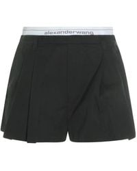 Alexander Wang - Logo-Waistband Pleated Shorts - Lyst
